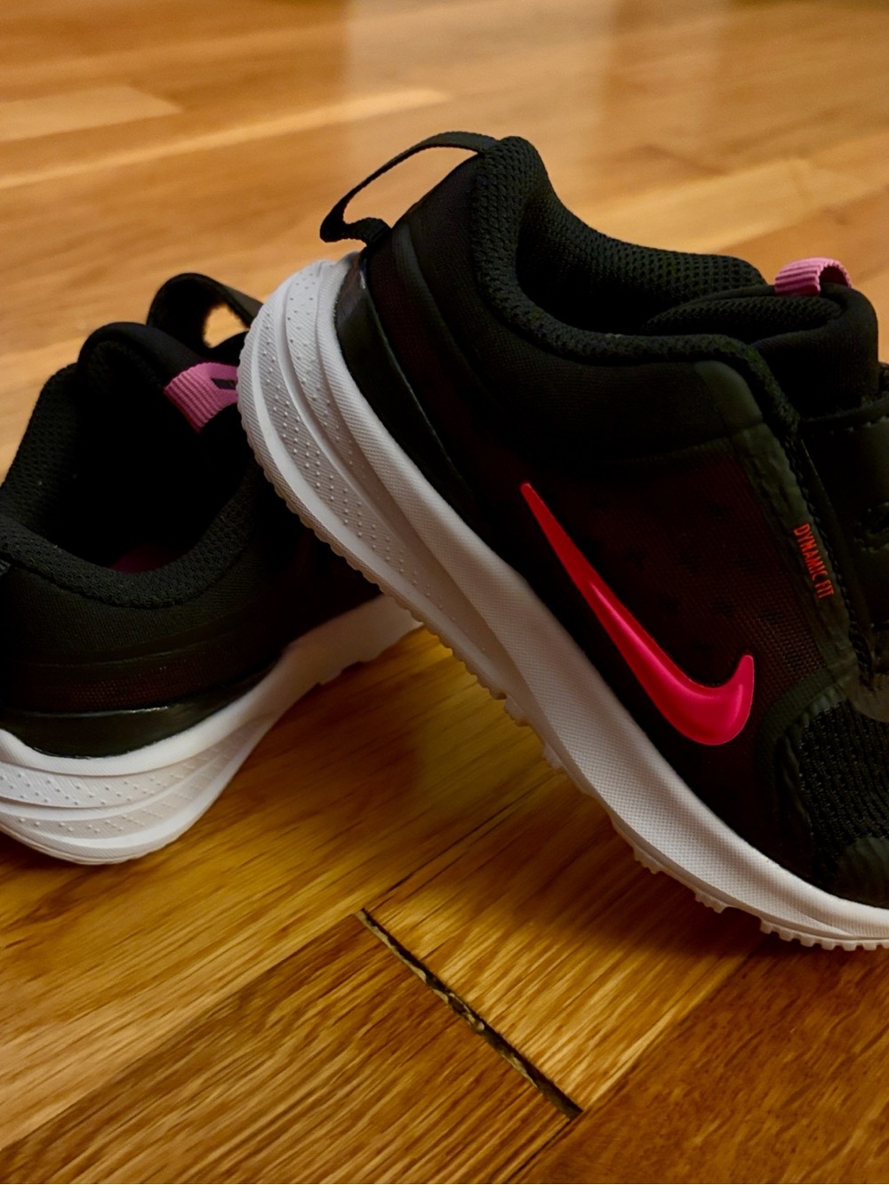 Nike Kids Black Sneakers with Pink Swoosh and White Sole
